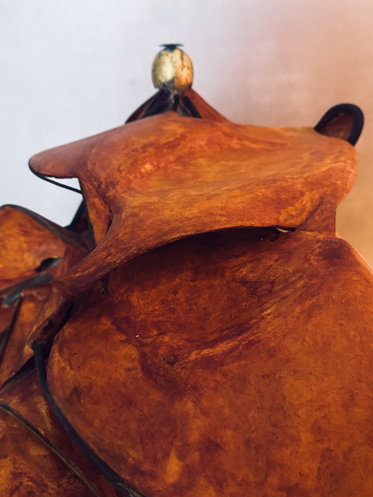 Detail from below: broad carved planes rising towards the gilded egg