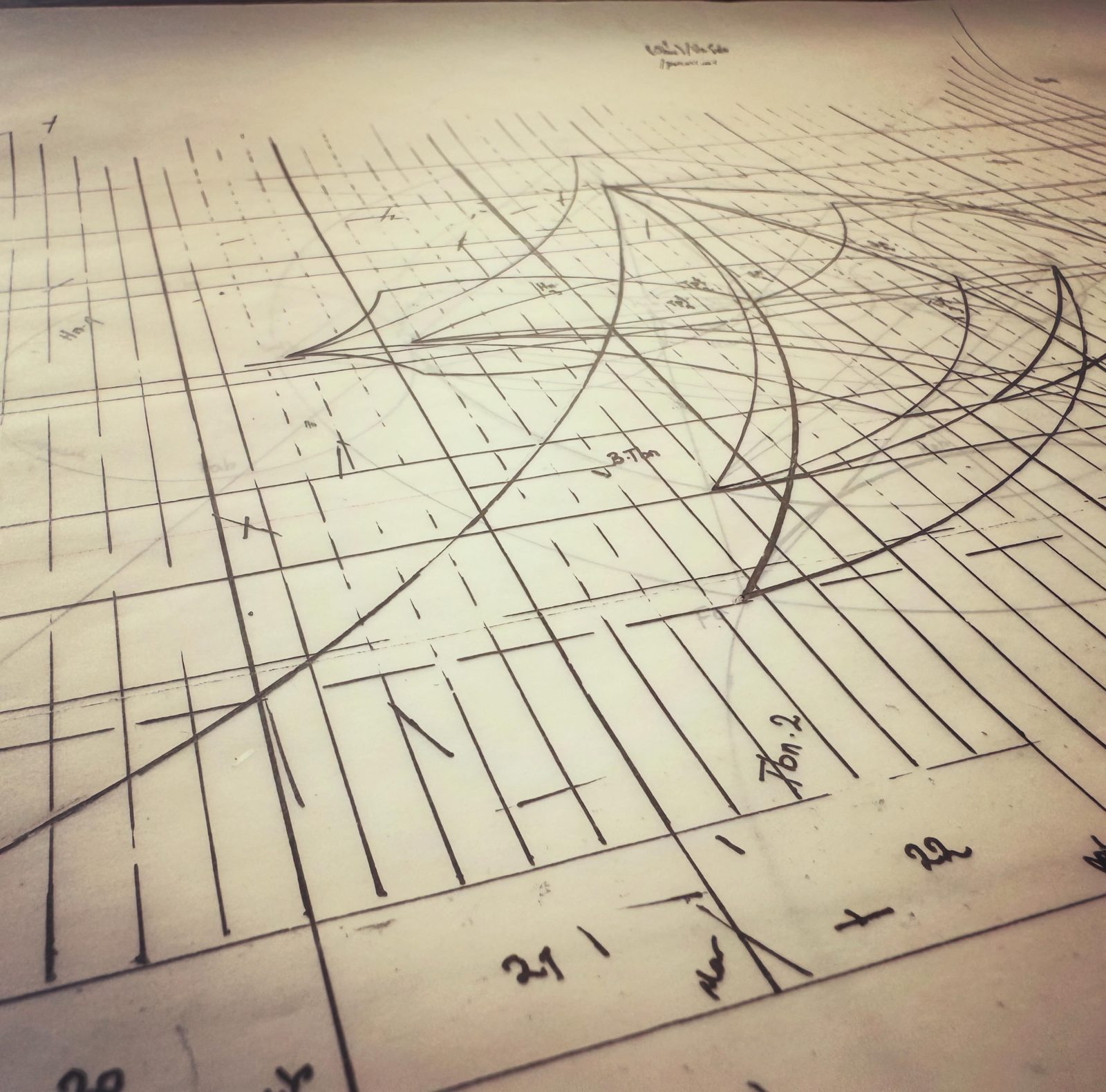 Pencil working drawing of a grid of lines crossed by sweeping curves, with instrument names and bar numbers